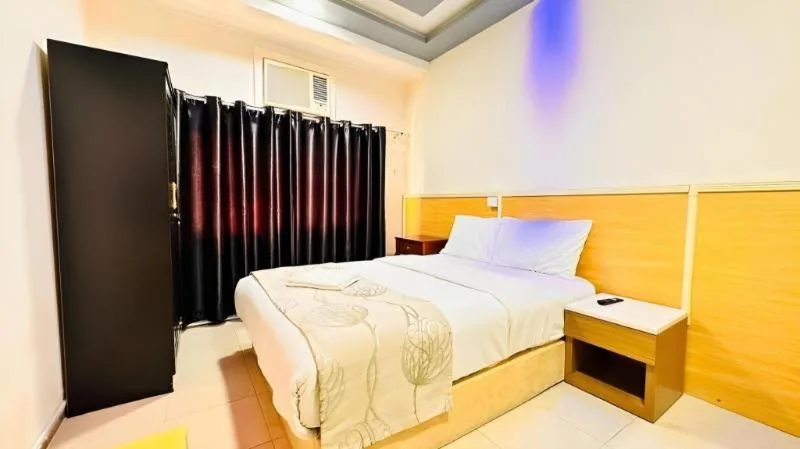 Bright guest room at Sharjah Plaza Hotel